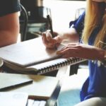 Community Projects - Person Writing on the Notebook