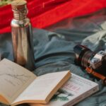 Camp Gadget - Thermos books and photo camera on camp tent