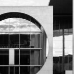 Local Authorities - Grayscale Photo of Building Near Body of Water