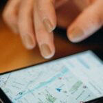 GPS Devices - Person Holding Black Android Smartphone