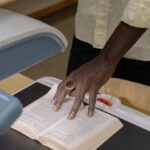 Service Learning - Person in White Button Up Shirt Holding White Printer Paper