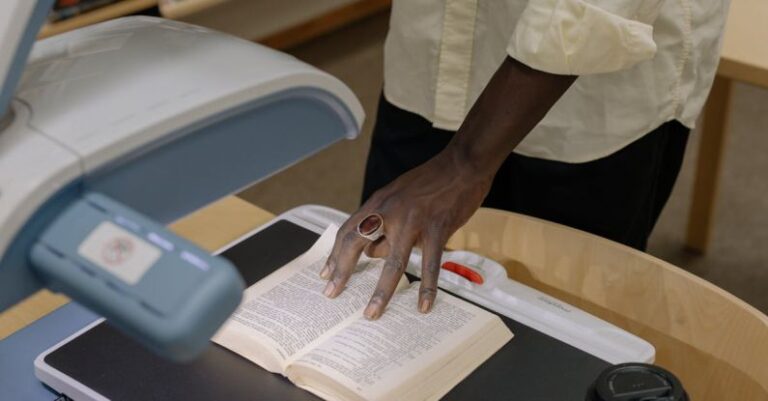 Service Learning - Person in White Button Up Shirt Holding White Printer Paper