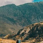 Hiking Pace - A person walking on a rocky path in the mountains