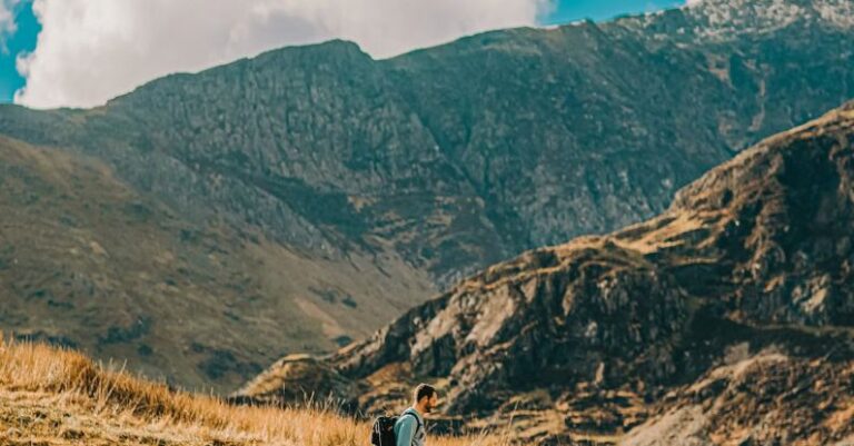 Hiking Pace - A person walking on a rocky path in the mountains