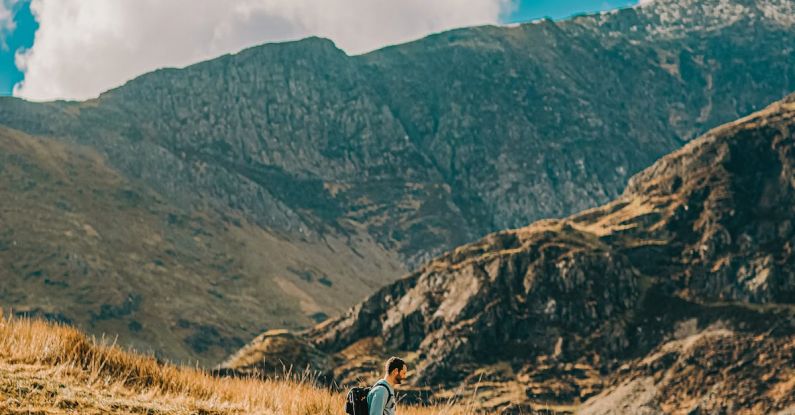 Hiking Pace - A person walking on a rocky path in the mountains