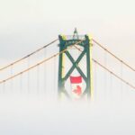 Rope Bridge - The Canadian Flag Hangs Above A Suspension Bridge