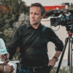 Media Coverage - Man Holding Microphone While Talking to Another Man