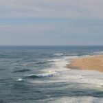 Lashing - Sea Waves Gently Lashing against Sandy Beach