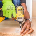 Woodworking Projects - Person Using Dewalt Cordless Impact Driver on Brown Board