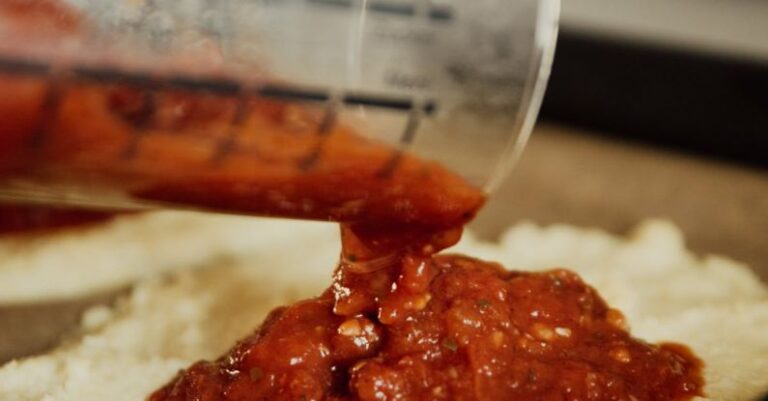 Food Handling - Clear Glass Jar Pouring Red Sauce Pizza Crust