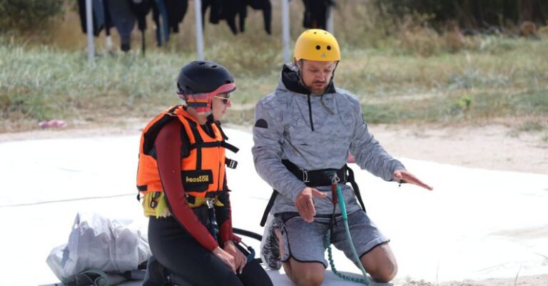 Life Lessons - Man Teaching a Kite Surfer