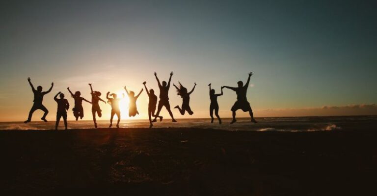 Community Service - Silhouette Photography of Group of People Jumping during Golden Time