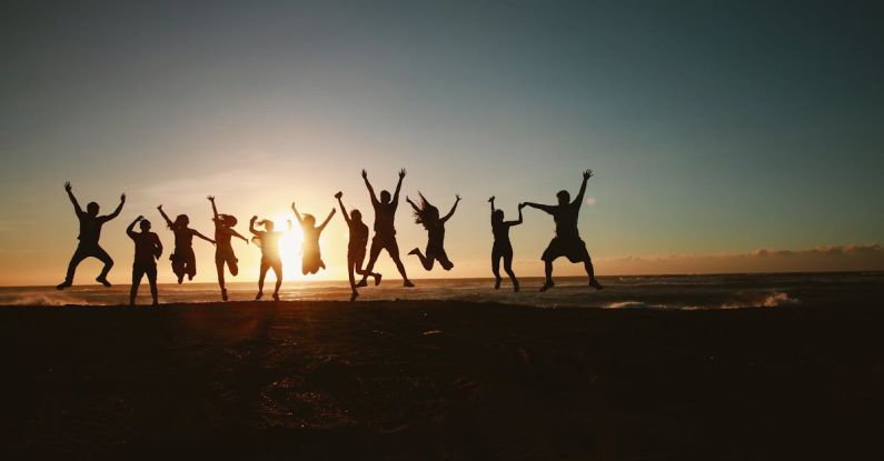 Community Service - Silhouette Photography of Group of People Jumping during Golden Time